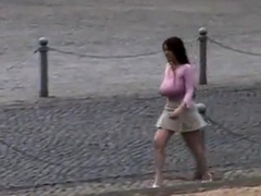 Busty girl walking, no bra, jiggling
