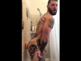 Tatted Hunk Fucks Dildo in Shower Until He Cums