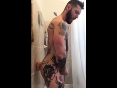 Tatted Hunk Fucks Dildo In Shower Until He Cums