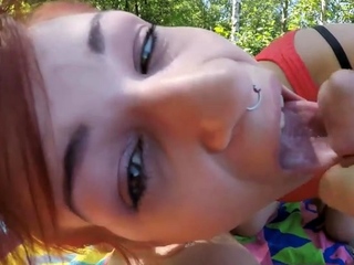 Outdoor sex at the lake with a red-haired slut