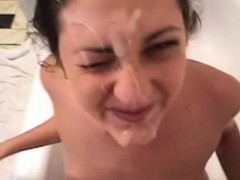 Brunette suck my dick in a bathtub and takes big facial